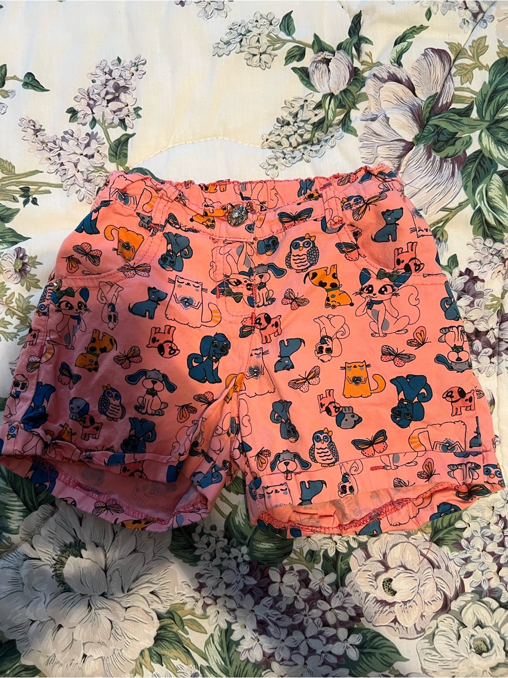 Girls size 8 pink shorts cartoons of dogs, cats, owls, and butterflies.